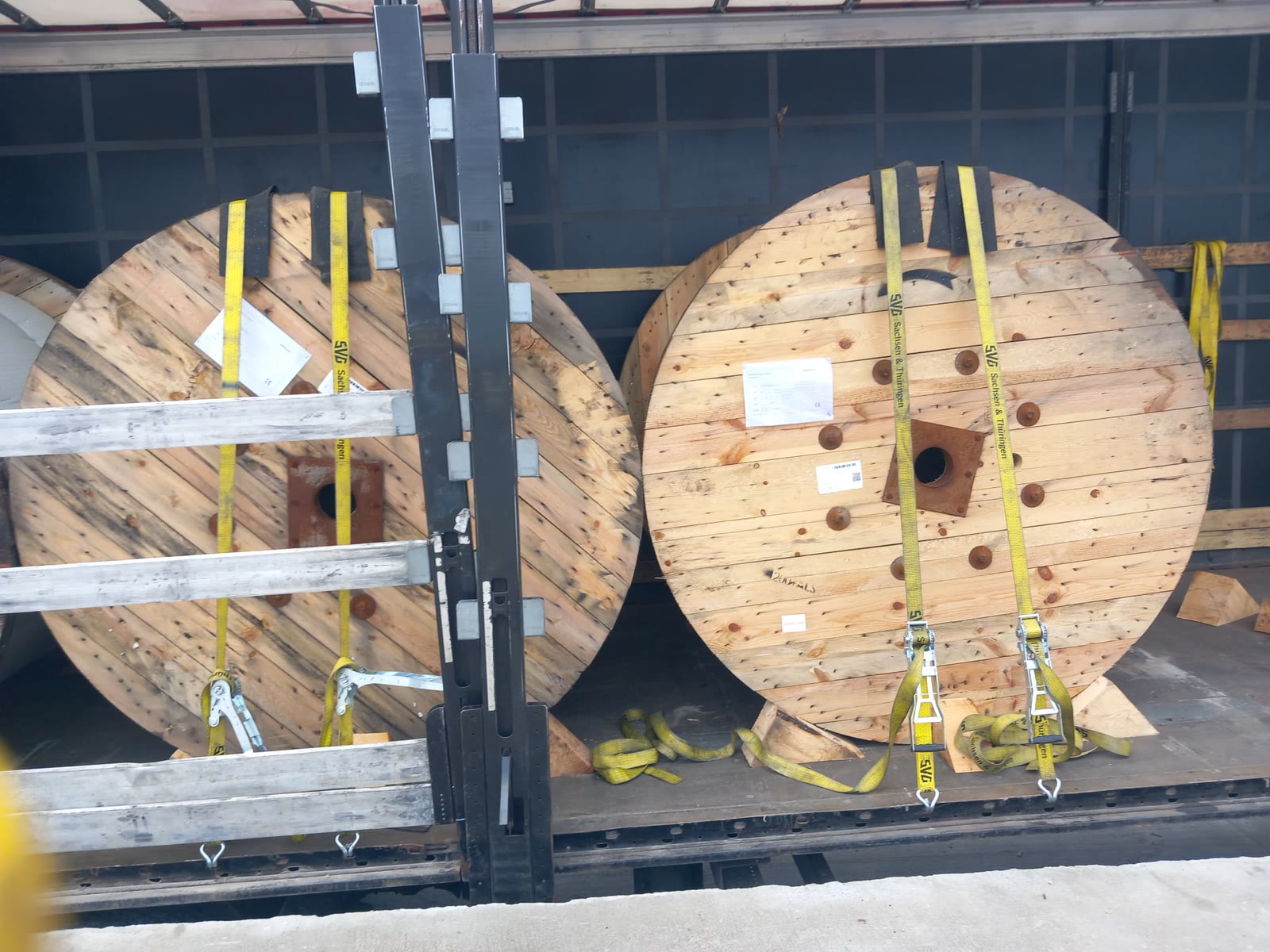 Heavy machinery parts secured on a reinforced pallet